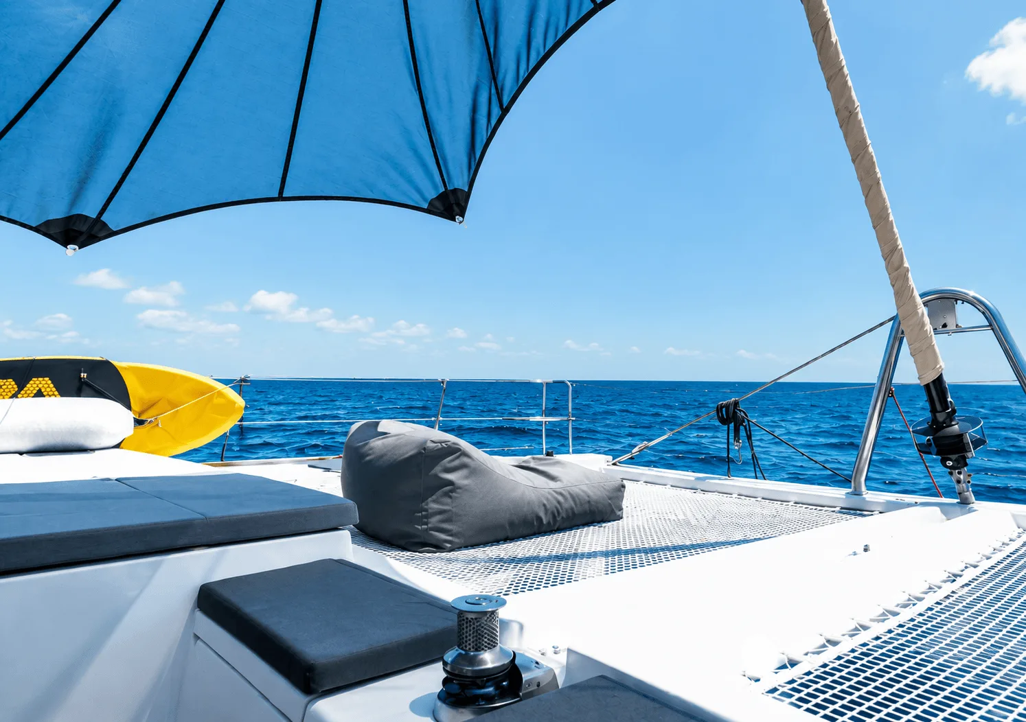 Shaded deck of a sailing catamaran under a sunshade, Ionian sailing itinerary